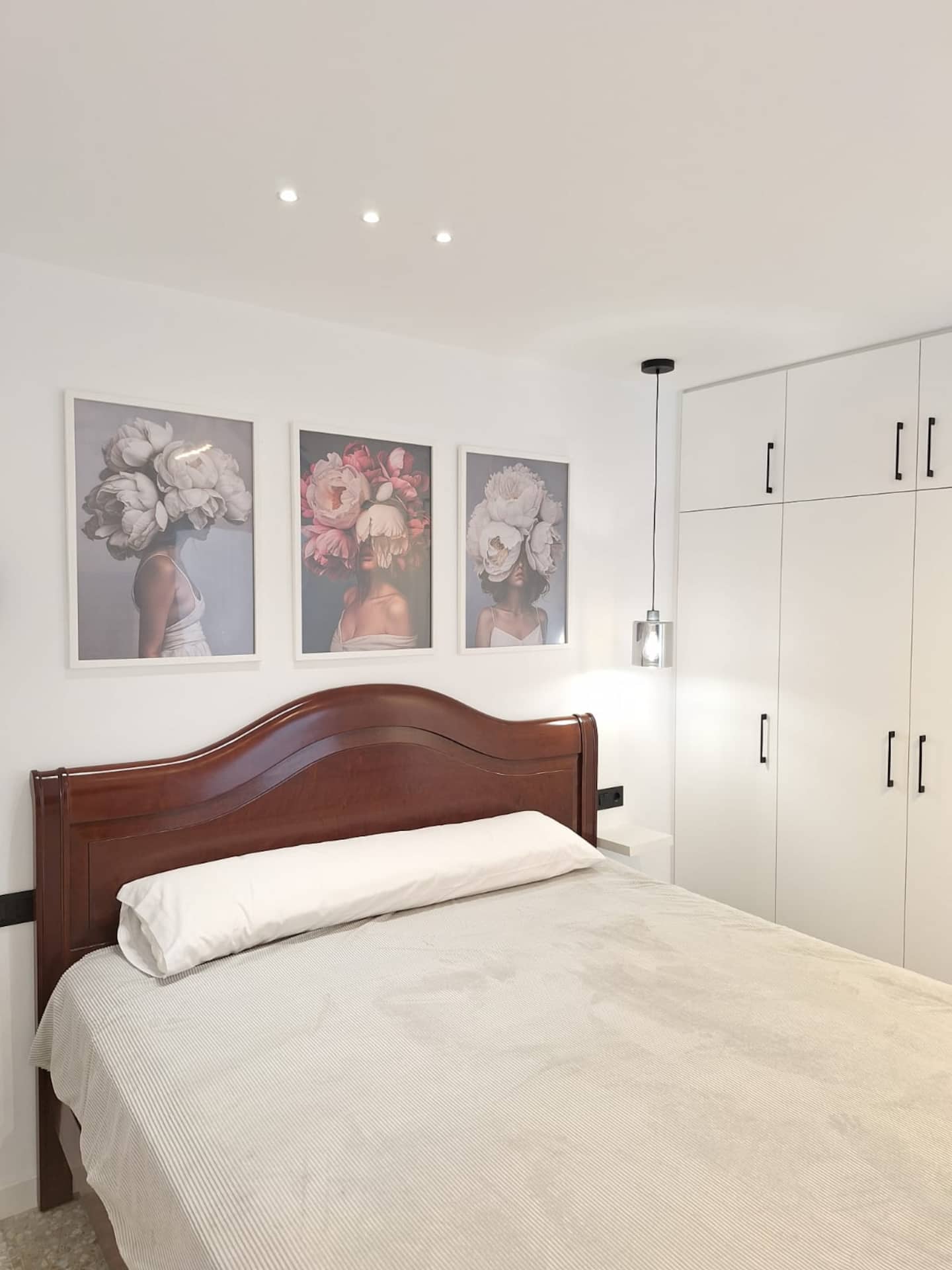 Bedroom 1: king bed with wooden headboard