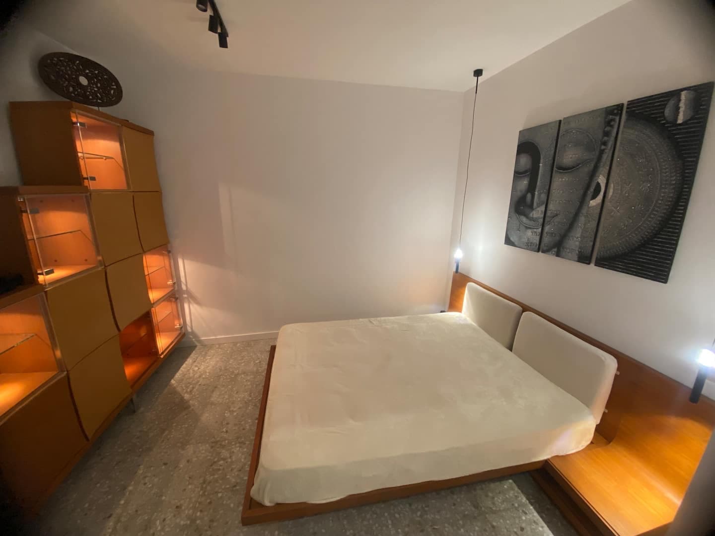 Bedroom 2: king bed and lit shelves
