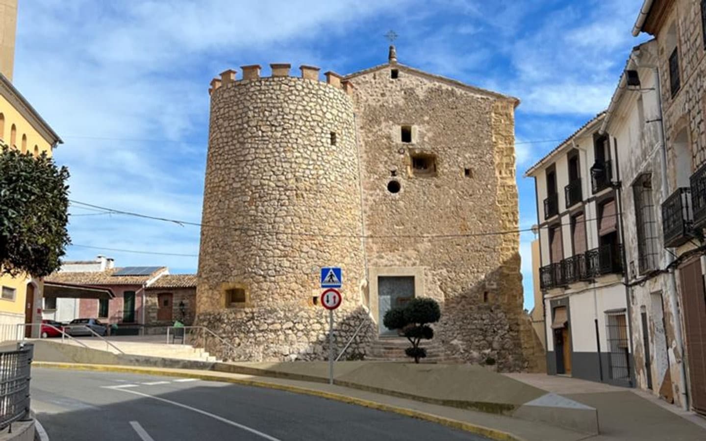 Medieval stone tower in a village on the Petata loop